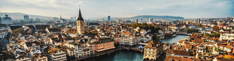 Panoramic view of Zurich, showcasing a mix of historic and modern buildings