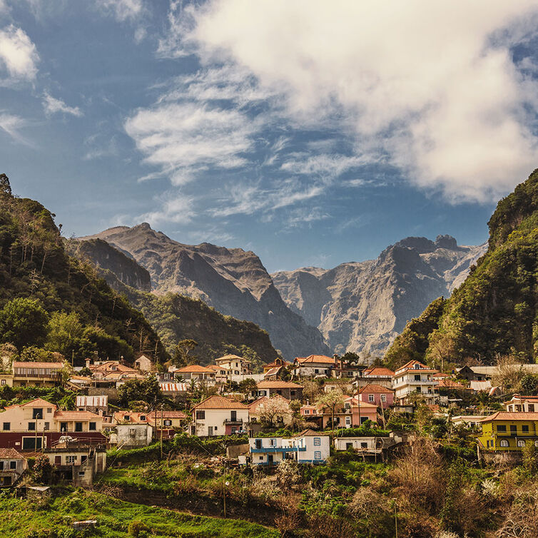 View of a village nestled between mountains in Madeira, Portugal