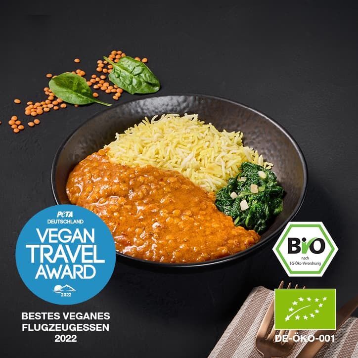 Gericht Indisches Linsen Dal mit Vegan Travel Award & Bio Abzeichen.