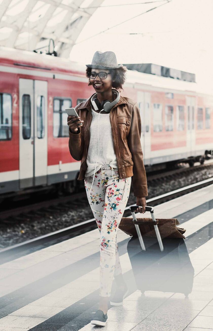 Woman in front of DB train on platform